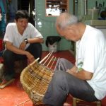 Sim Buck Teik working on rattan craft