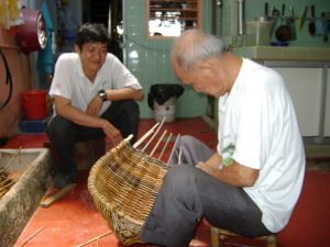 Sim Buck Teik working on rattan craft